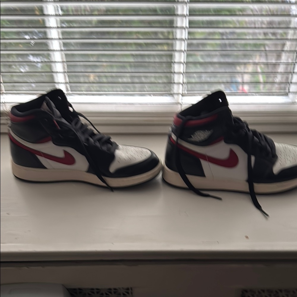 Black and White High-Top Sneakers with Red Accents